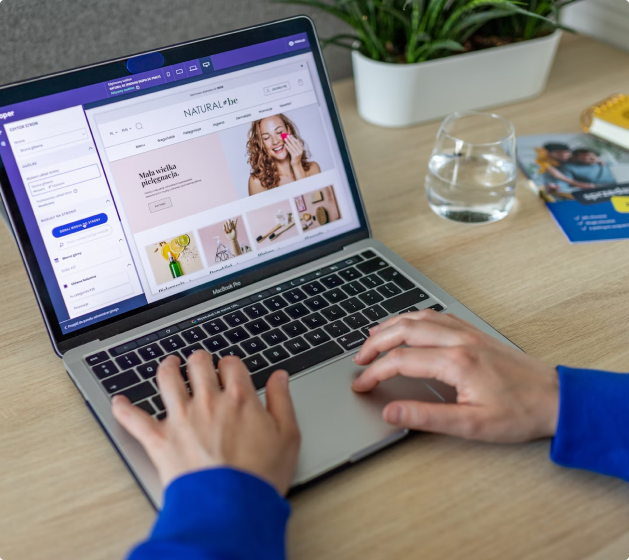 Person using a laptop to manage a Shopify online store